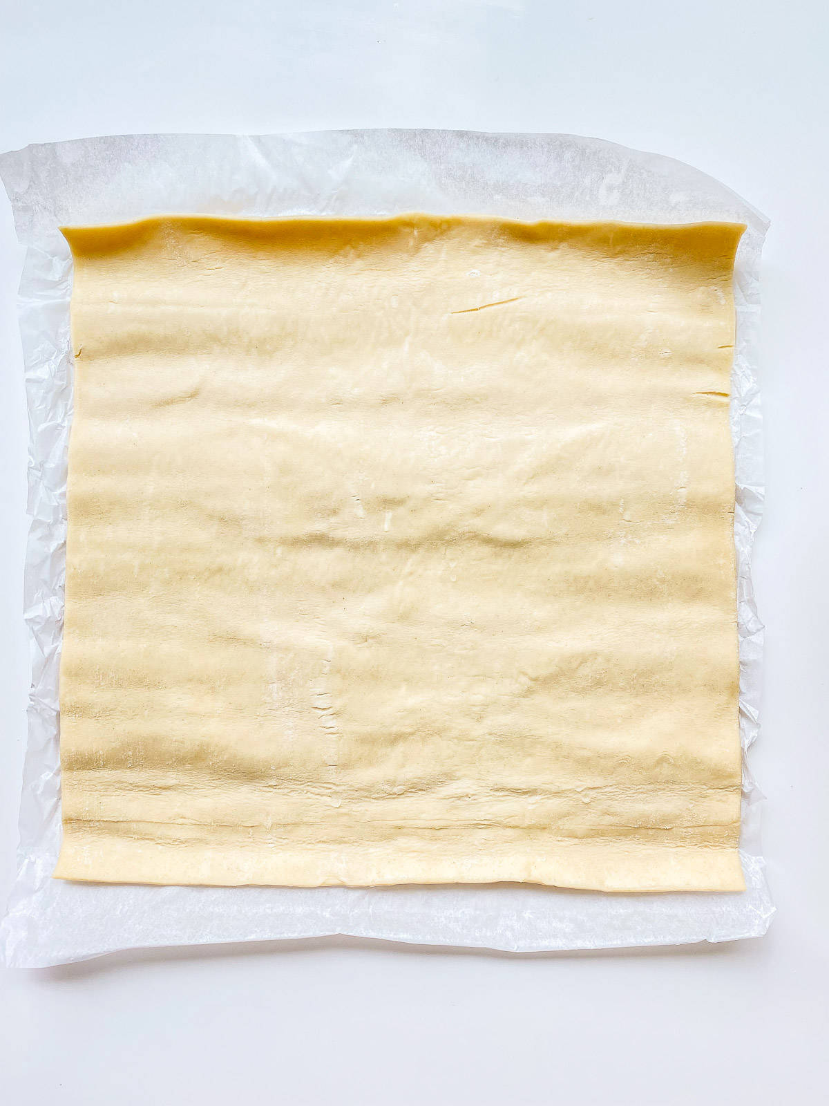 An image of a sheet of puff pastry.