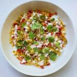 An image of the dish Street Corn Salad in a white ceramic bowl.