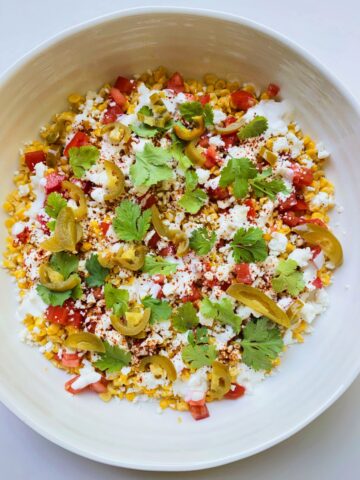 An image of the dish Street Corn Salad in a white ceramic bowl.