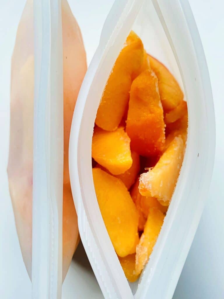 An image of frozen peach segments in a silicone pouch.