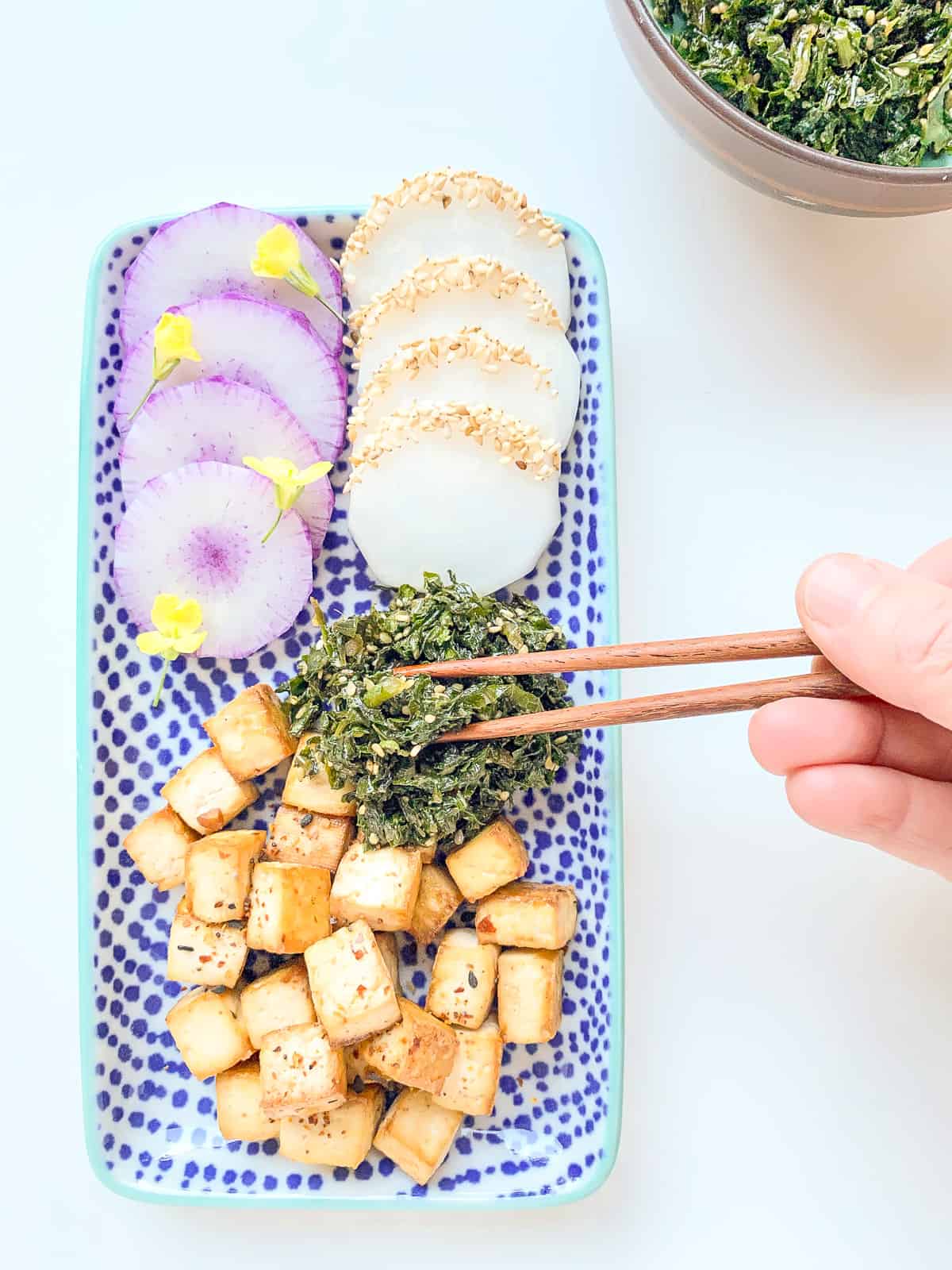 An image of Fresh Garden Furikake on a japanese style plate alongside radishes and tofu.