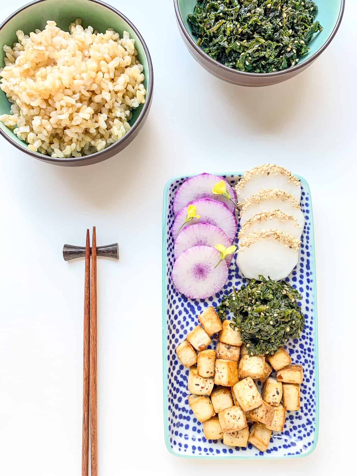 An image of Garden Fresh Furikake as part of a full meal alongside tofu, rice, and slides radishes.