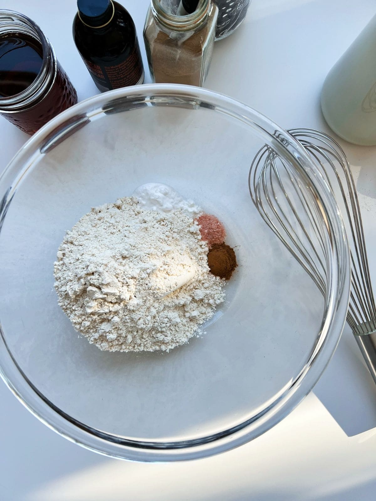 An image of the dry ingredients need for the recipe, in a glass bowl.
