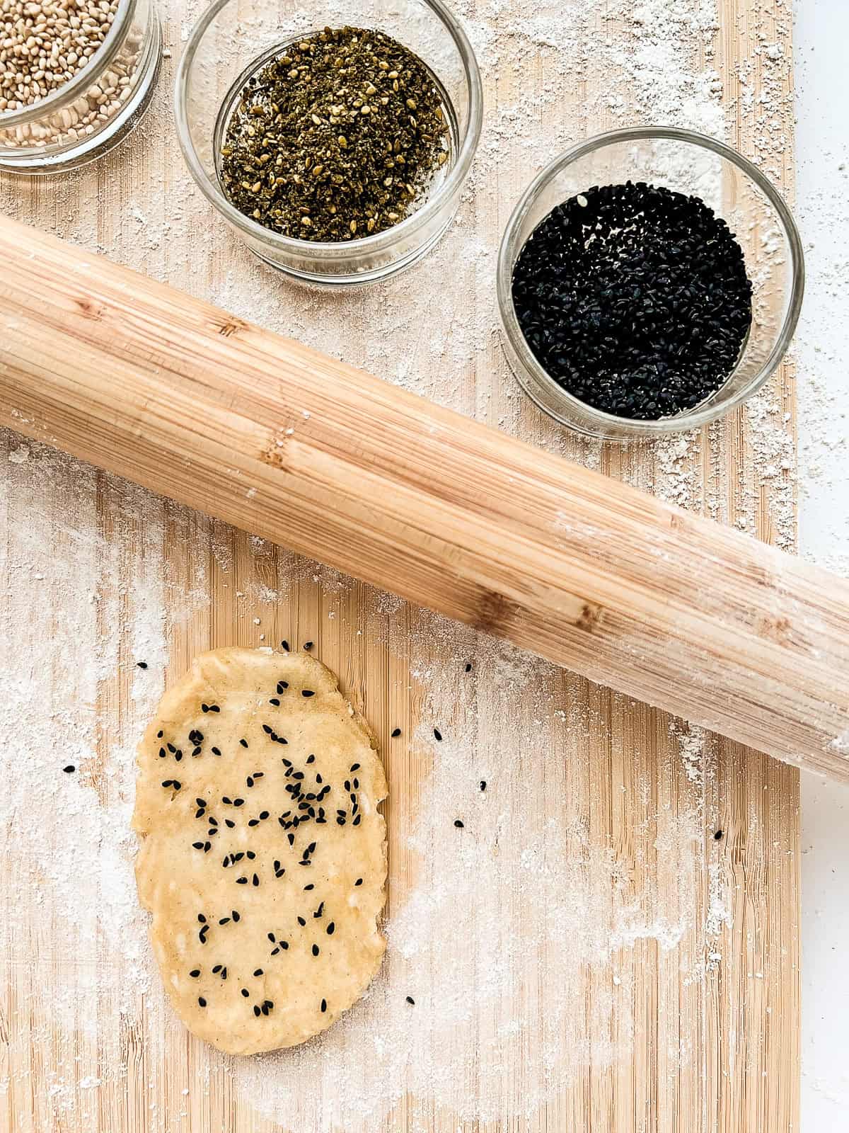 A ball of matzo with spices pressed into it before being rolled out.