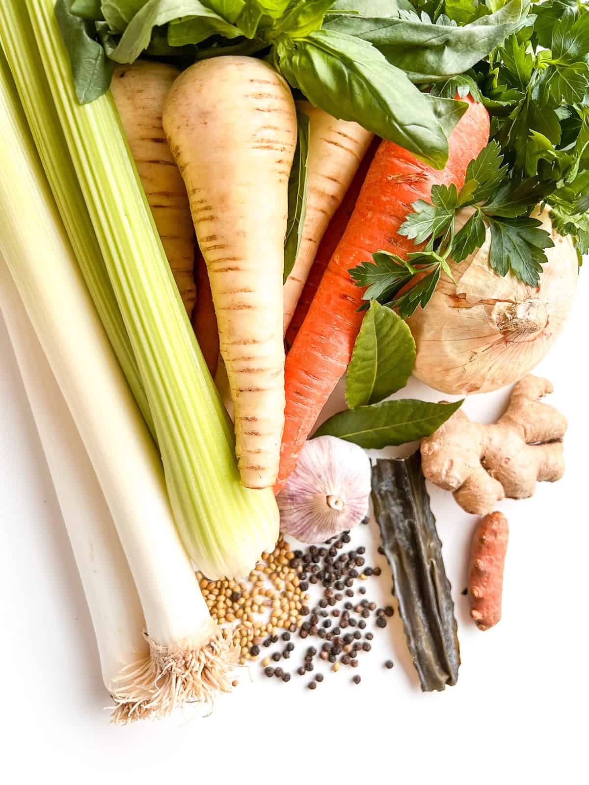 The ingredients needed to make Vegetarian Matzo Ball Soup mounded on a white counter.