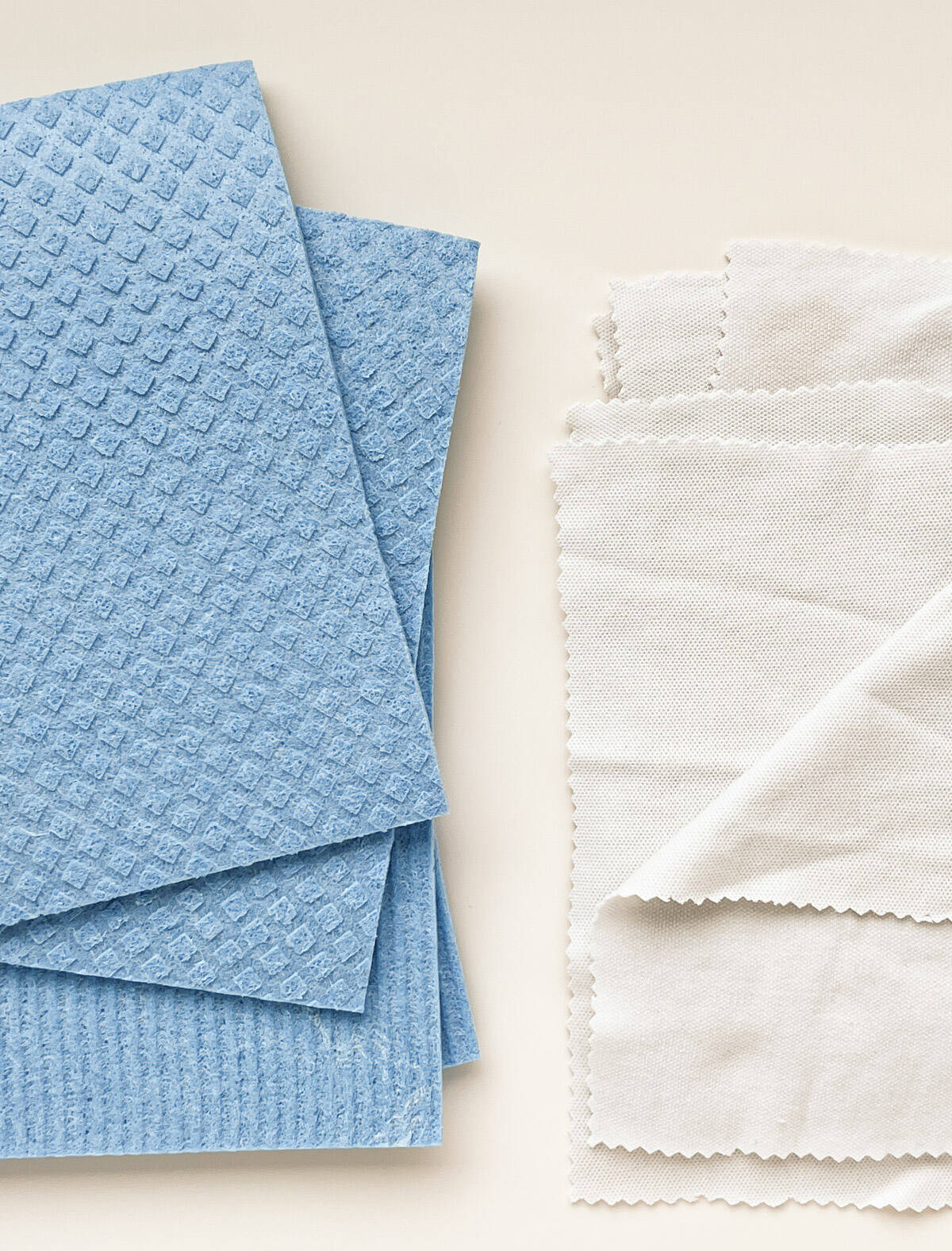 An image to two stacks of paper towel replacements, including cellulose towels and homemade fabric towels.