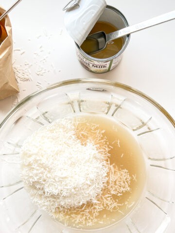 Condensed coconut milk being used in a recipe.