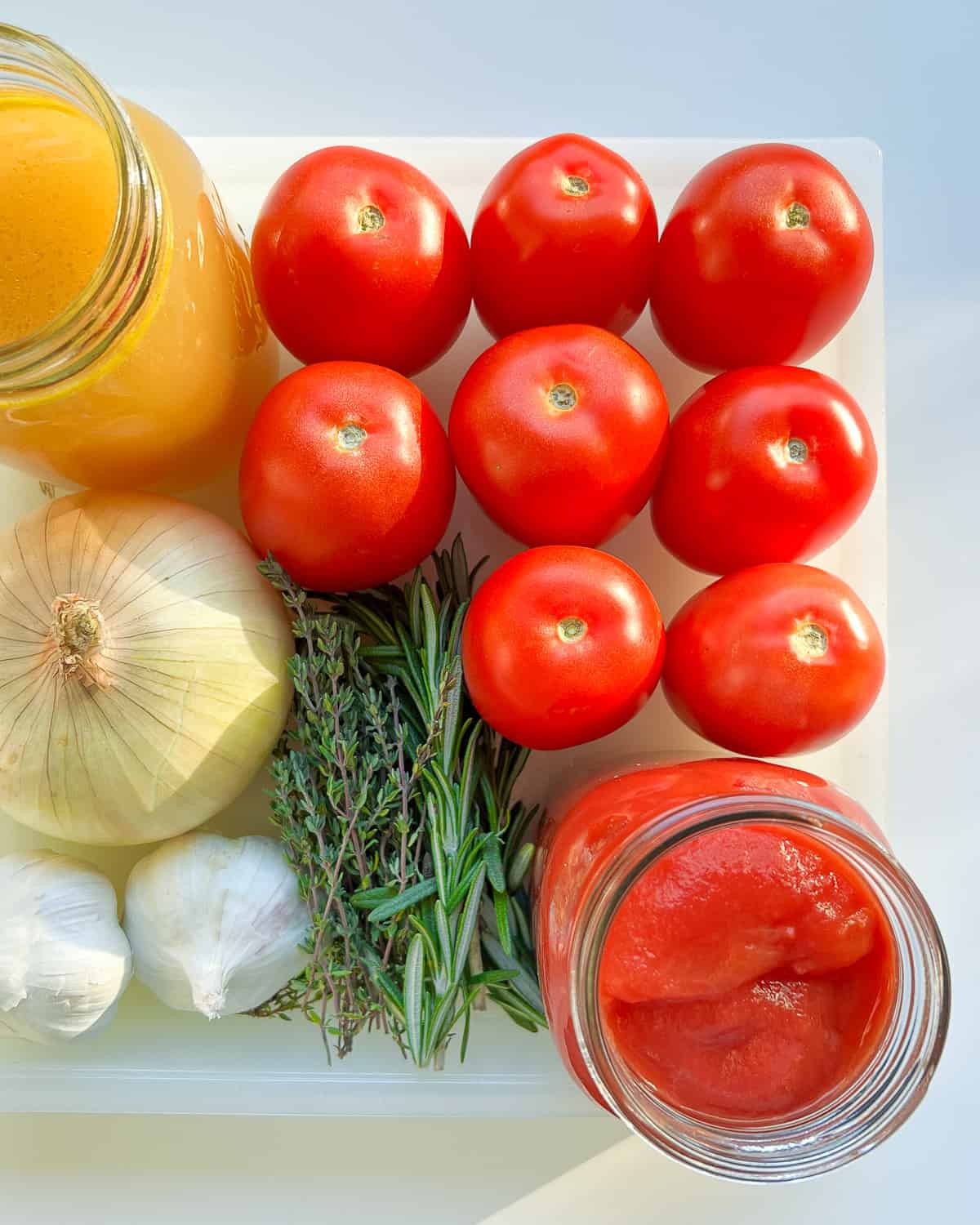 An image of the ingredients needed to make Roasted Tomato and Garlic Soup.