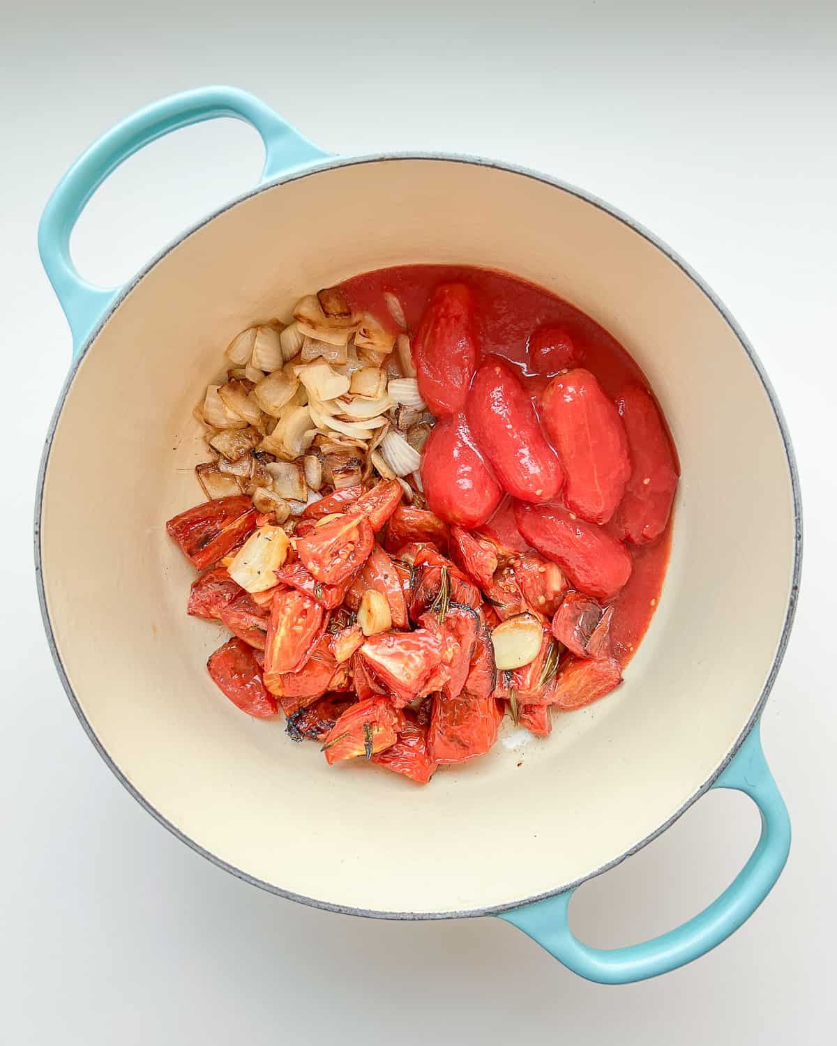 An image of all the ingredients needed for Roasted Tomato and Garlic Soup before the final cooking stage.