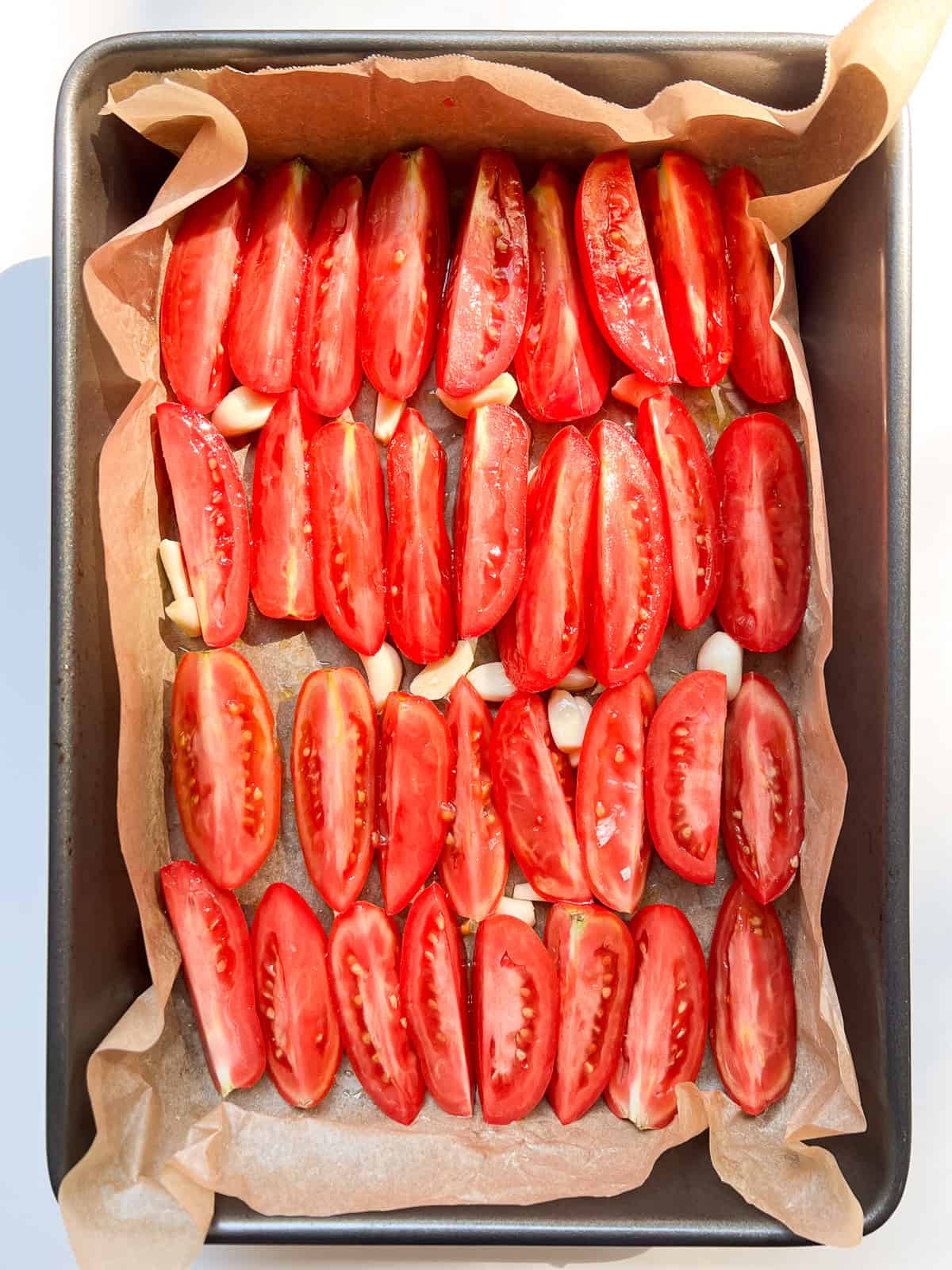 An image of a tray of Oven Roasted Tomatoes before roasting