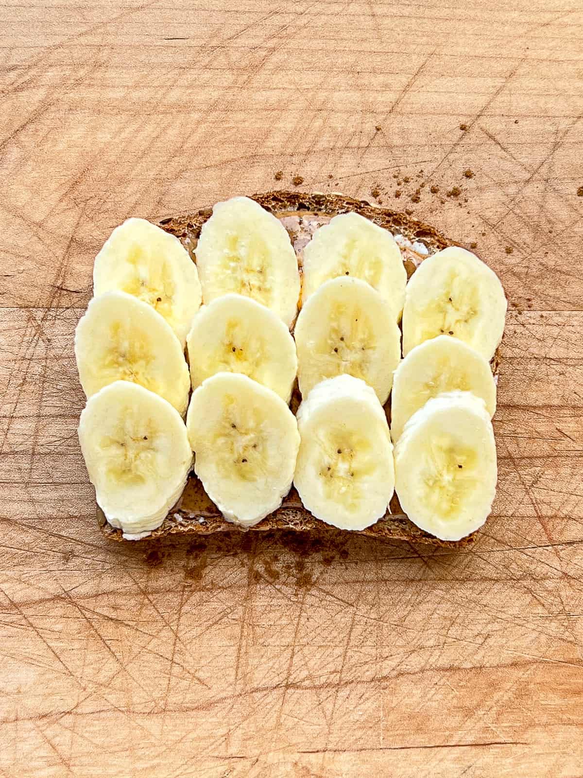 An image of banana slices laid out on toast.