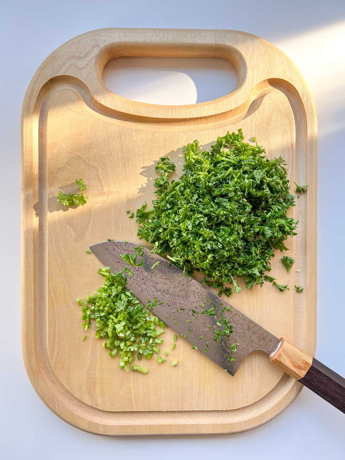 An image of parsley being chopped.