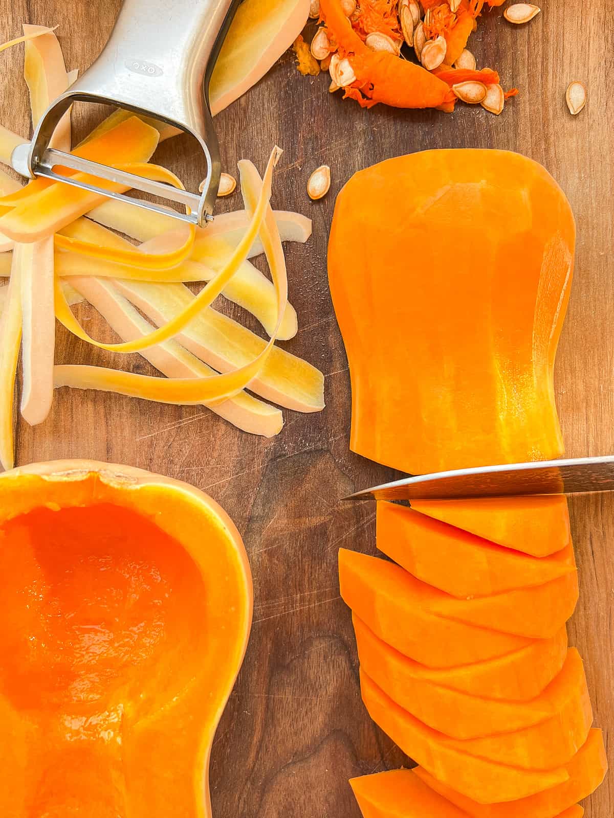 An image of peeled, seeded, and sliced butternut squash.