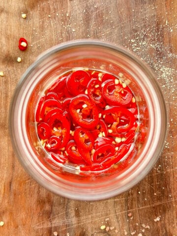 An image of a jar of pickled hot peppers.