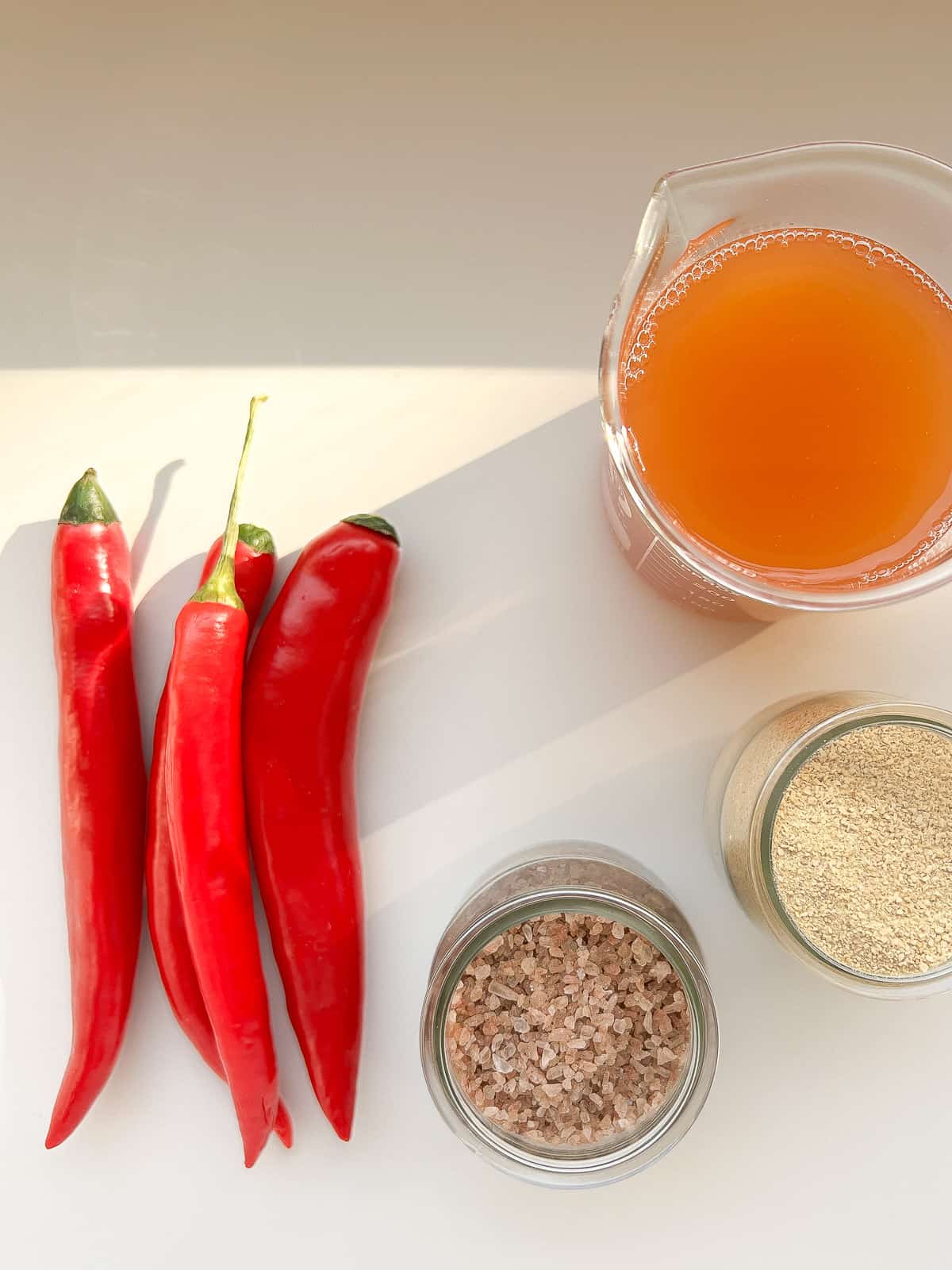 An image of the ingredients needs to make pickled hot peppers.