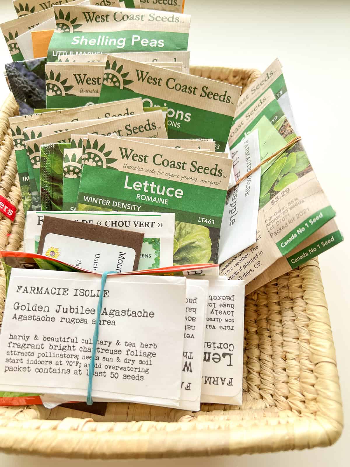 A basket filled with various seed packets.