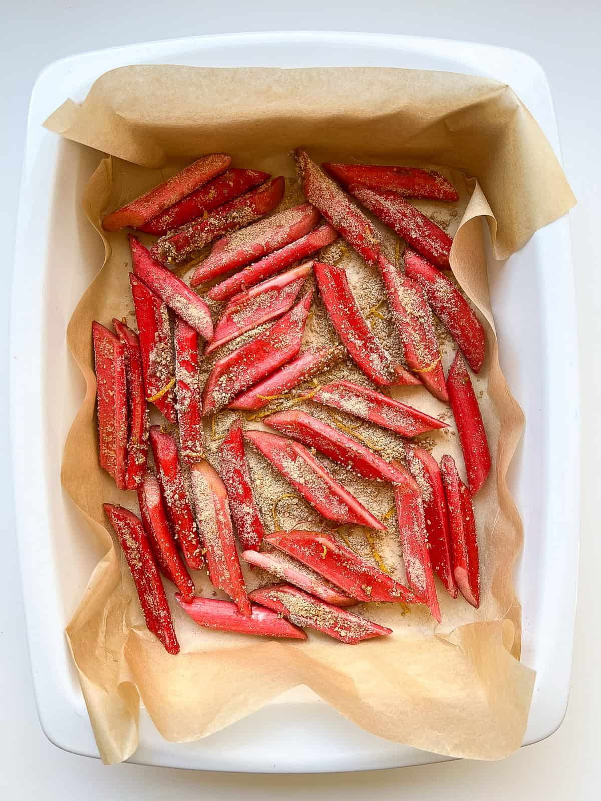 An image of cut rhubarb in a roasting tray before roasting.