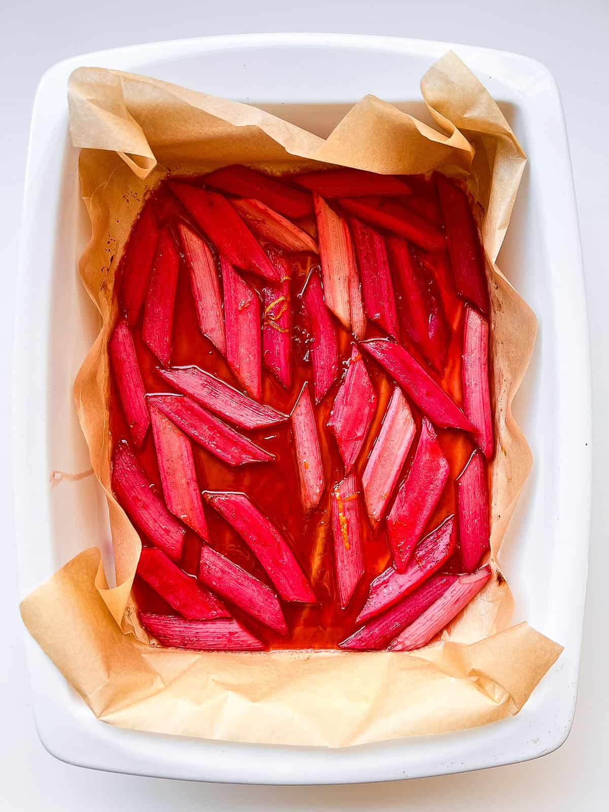 An image of cut rhubarb in a roasting tray after roasting.