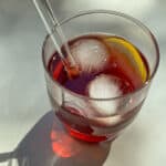 An image of a glass cup filled with Rooibos and Grape Iced Tea.
