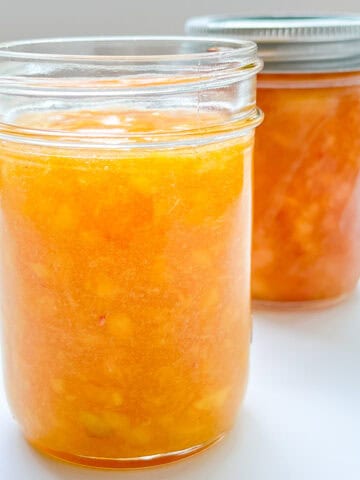 An image of two jars of freezer jam, one is at room temperature, one is frozen.