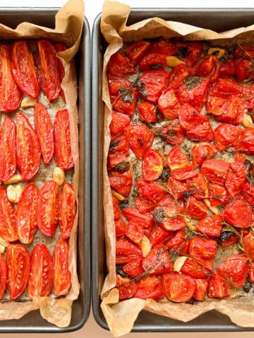 An image of two trays of Oven Roasted Tomatoes.