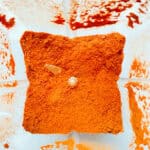 An image of ground tomato powder inside the canister of a blender.